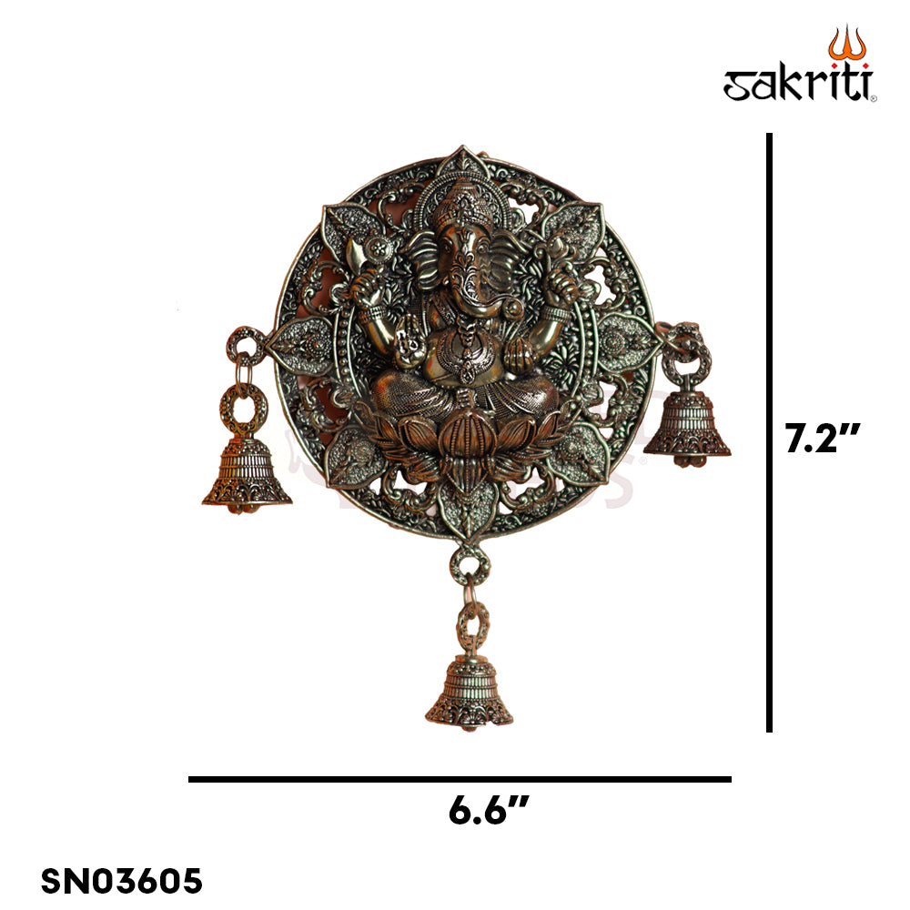 Sacred Needs Brass WC Ganesha Round Wall Mount with Bell – 7.2 Inch (18.3 cm) Height | Decorative Brass Ganesha Wall Hanging for Pooja Room & Entrance