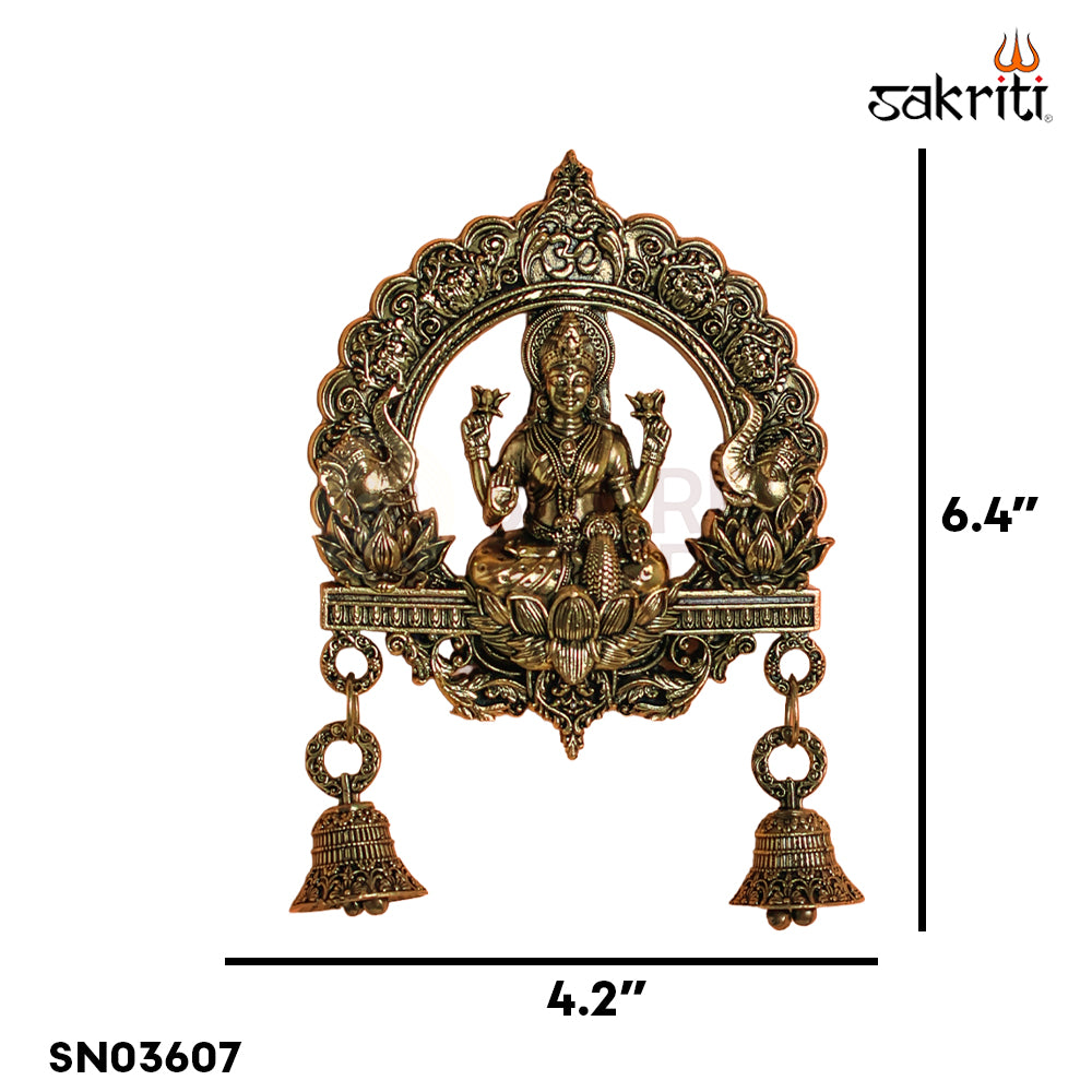 Sacred Needs Brass WC Lakshmi Wall Mount with Frame & Bell – 6.4 Inch (16.3 cm) Height | Decorative Lakshmi Wall Hanging for Pooja Room & Entrance