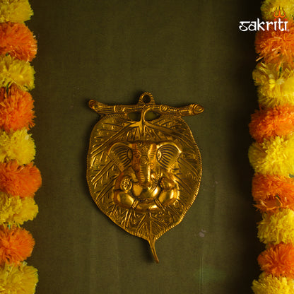 Sacred Needs Brass Stem Leaf Ganesha Wall Mount – 8 Inch (20.3 cm) Height | Decorative Lord Ganesha Brass Wall Hanging for Pooja Room & Home Décor