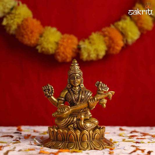 Sacred Needs Brass Lotus Saraswathi Idol – 5.5 Inch (14 cm) Height | Goddess Saraswati Statue for Education, Wisdom & Pooja Décor