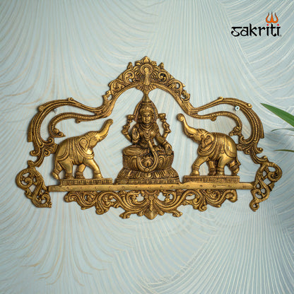 Sacred Needs Brass Gajalakshmi Plate Wall Mount – 11.2 Inch (28.4 cm) Height | Decorative Goddess Lakshmi Wall Hanging for Pooja Room & Home Décor