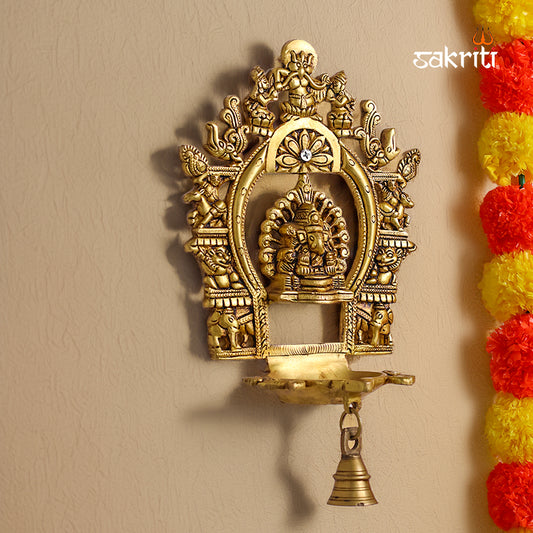 Sacred Needs Brass Wall Mounted Ganesh Deepam with Frame – 11 Inch (27.9 cm) Height | Ganesha Oil Lamp Wall Hanging for Pooja Room & Temple