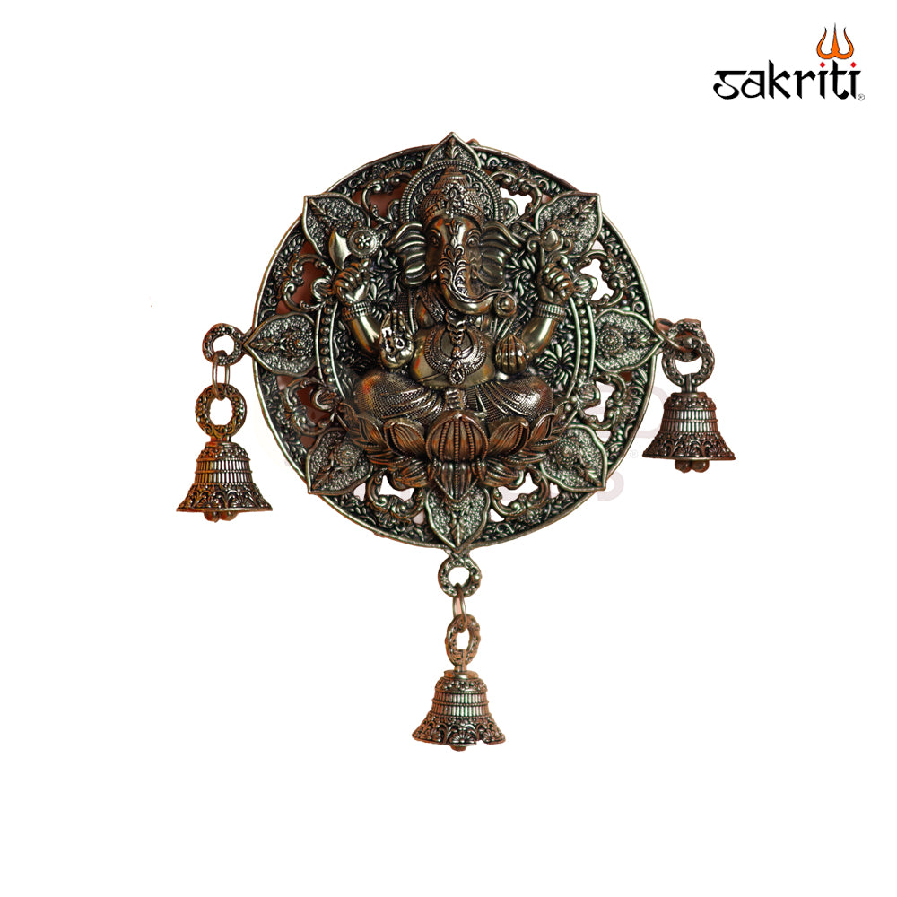 Sacred Needs Brass WC Ganesha Round Wall Mount with Bell – 7.2 Inch (18.3 cm) Height | Decorative Brass Ganesha Wall Hanging for Pooja Room & Entrance
