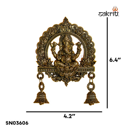 Sacred Needs Brass WC Ganesha Wall Mount with Frame & Bell – 6.4 Inch (16.3 cm) Height | Decorative Ganesha Wall Hanging for Pooja Room & Entrance