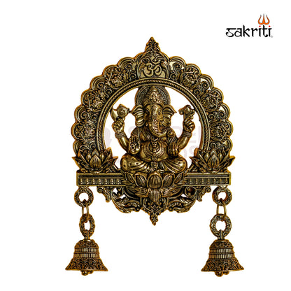 Sacred Needs Brass WC Ganesha Wall Mount with Frame & Bell – 6.4 Inch (16.3 cm) Height | Decorative Ganesha Wall Hanging for Pooja Room & Entrance