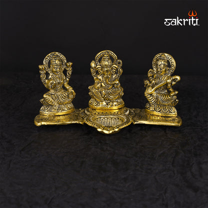 ALUMINIUM LAKSHMI-GANESHA-SARASWATI WITH DEEPAM