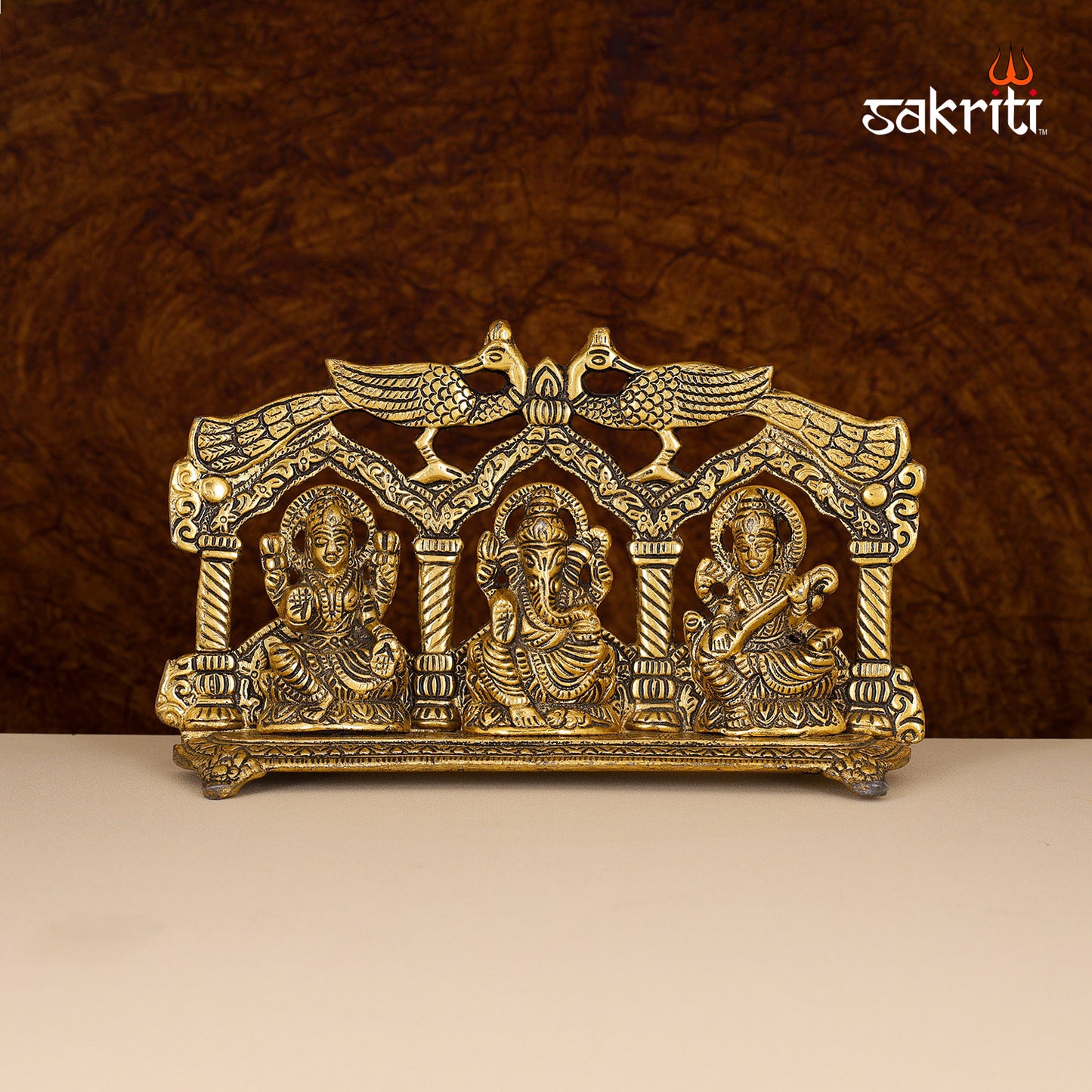 ALUMINIUM LAKSHMI-GANESHA-SARASWATHI FRAME WITH PEACOCK