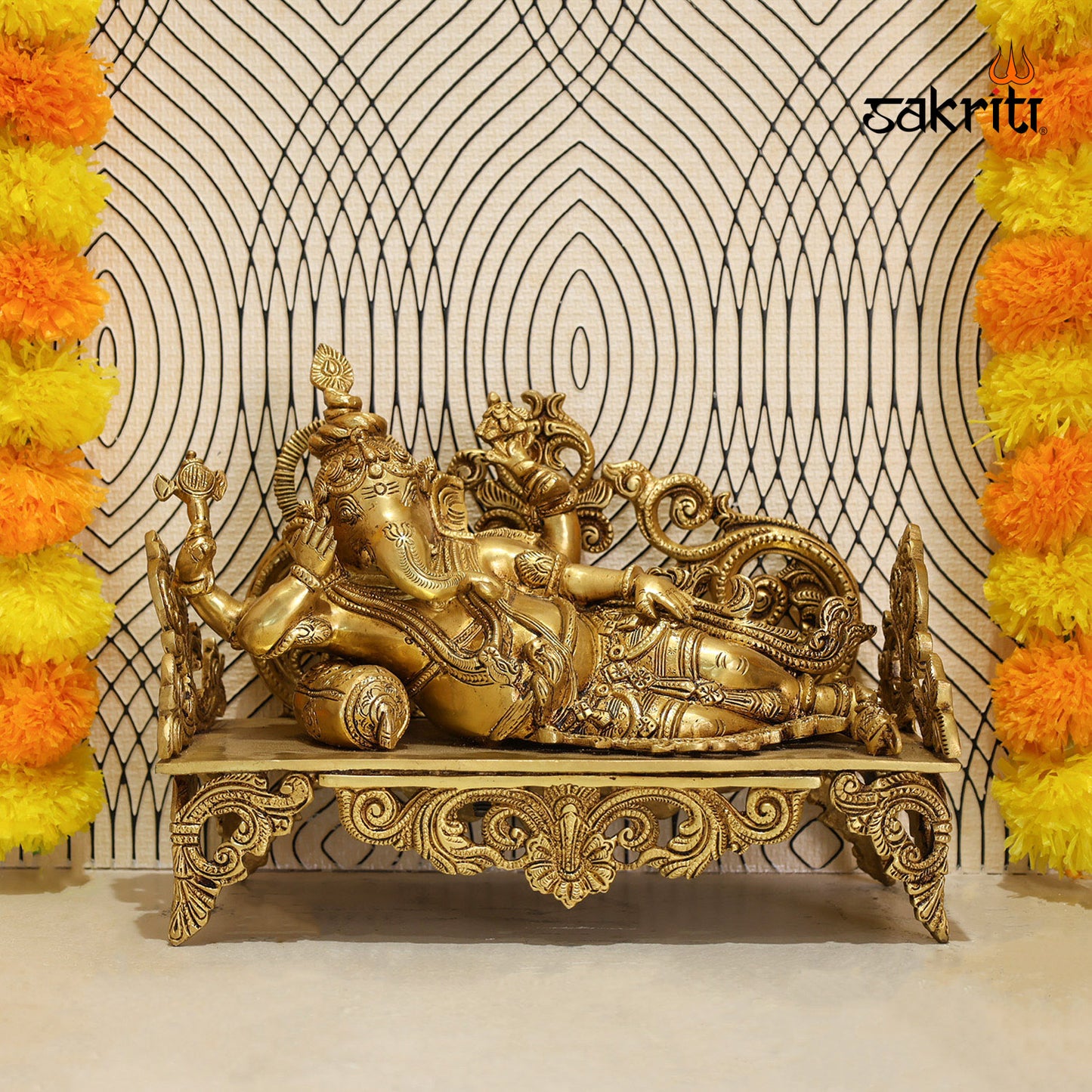 BRASS GANESHA ON SOFA